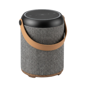 A bluetooth speaker with a leather strap on it.