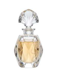 A clear glass perfume bottle with a floral design on it.
