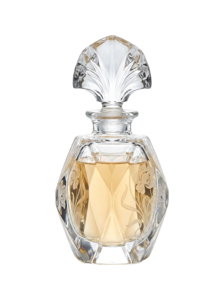 A clear glass perfume bottle with a floral design on it.