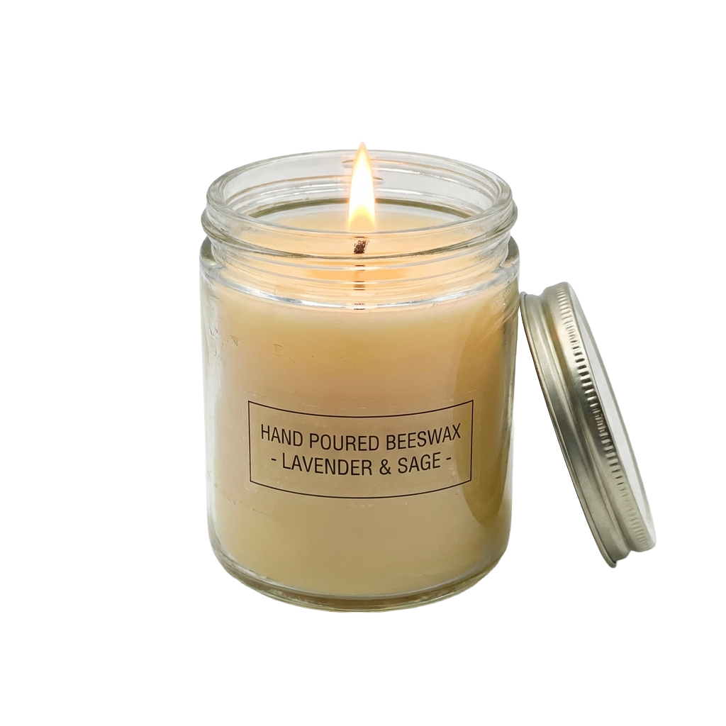 A glass jar with a candle inside of it.