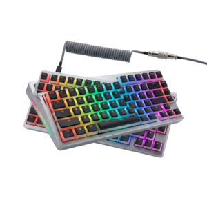 A pair of keyboards sitting next to each other on a white surface.