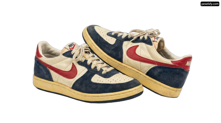 Pair of blue and red sneakers on a white background png transparent background
