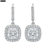 Pair of white gold earrings with a cushion cut diamond png transparent background