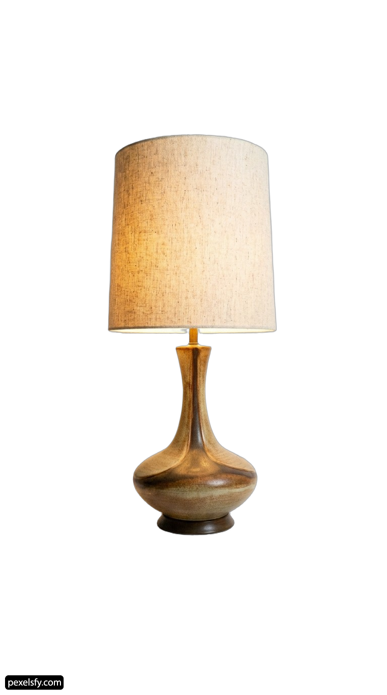 Table lamp with a beige shade on it png transparent background