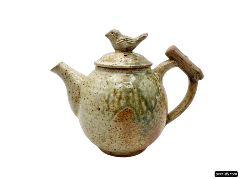 Teapot with a bird on top of it png transparent background