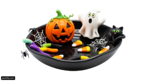 Black bowl filled with halloween decorations on top of a table png transparent background