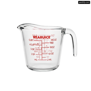 Clear glass measuring cup with measurements on it png transparent background