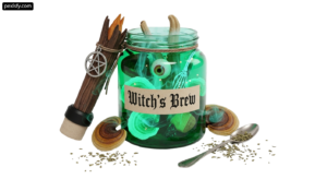 Glass jar filled with green liquid next to a spoon png transparent background