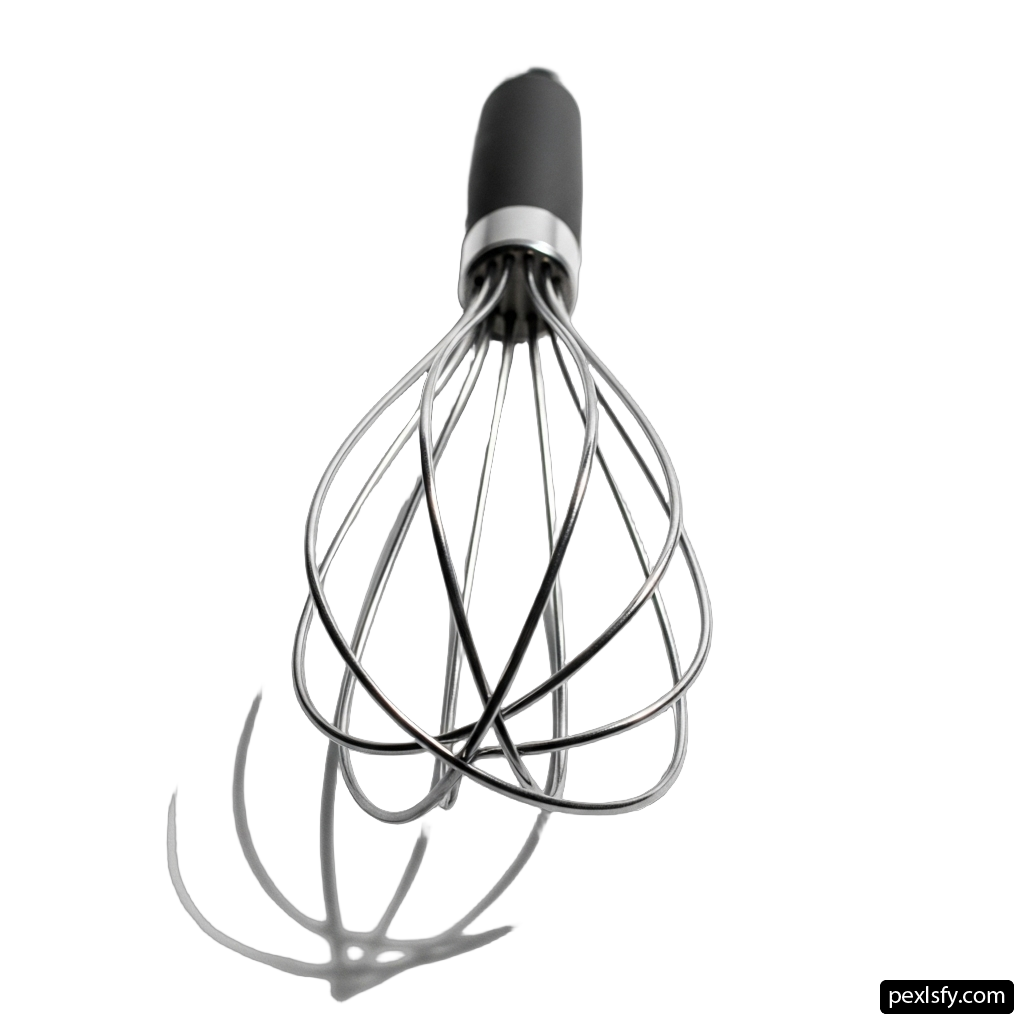 Metal whisk with a black handle on a white background png transparent background