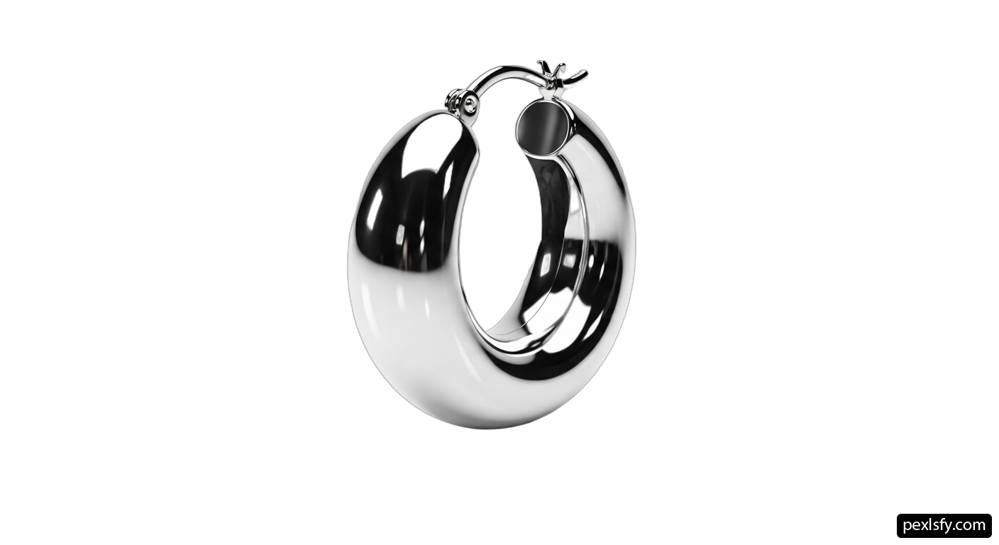 Pair of silver hoop earrings on a white background png transparent background